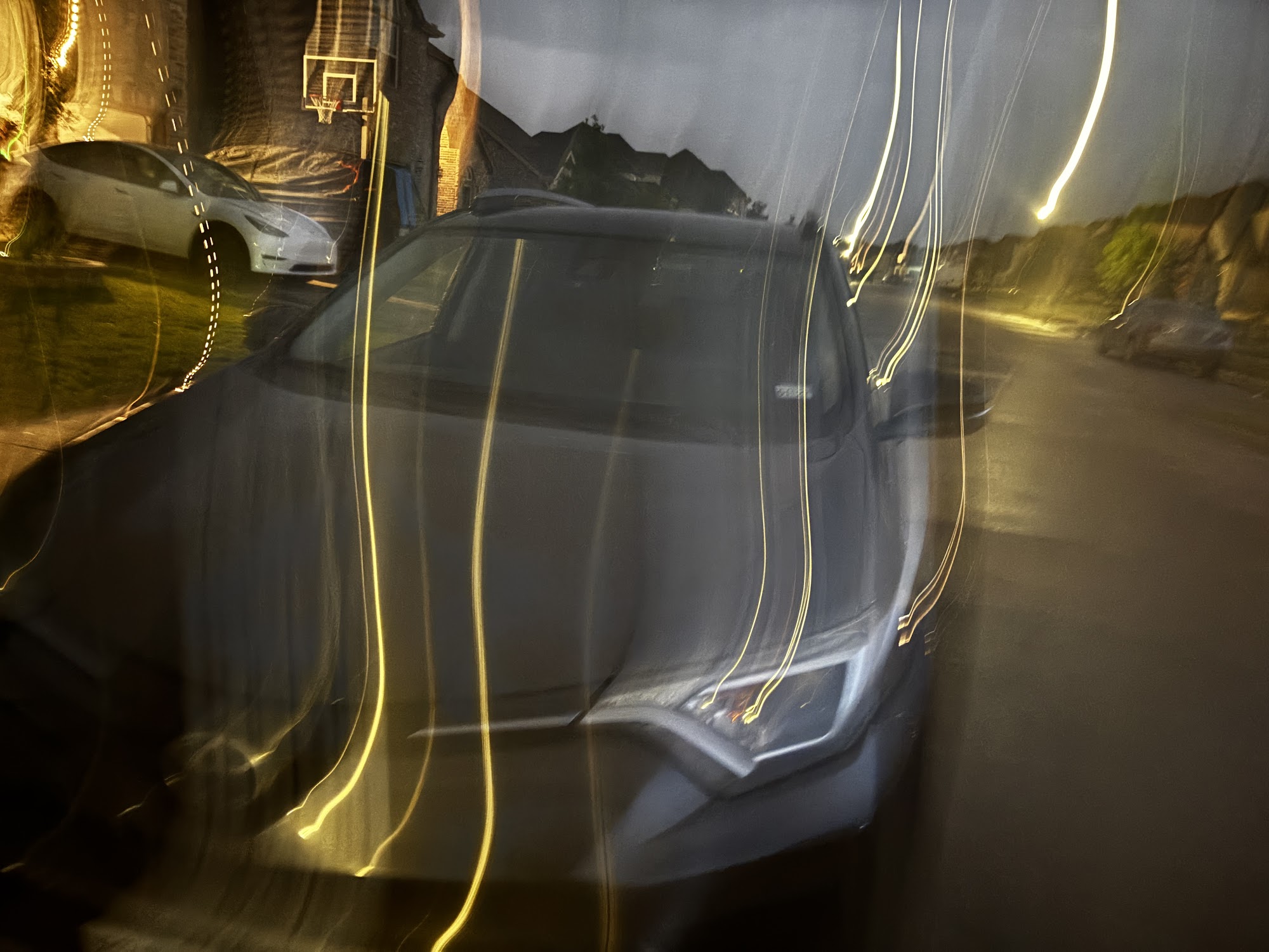 Glossy sealed paint reflecting light after a ceramic spray sealant application