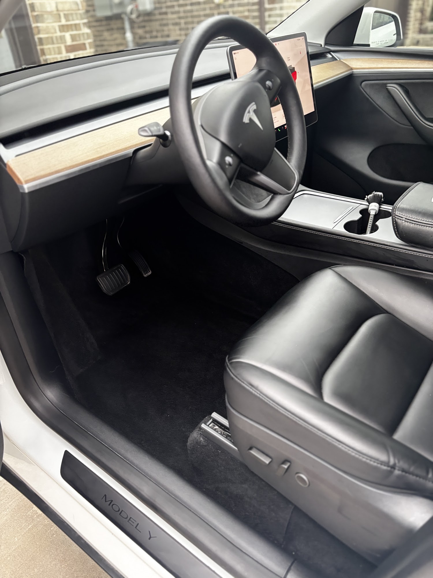 Vehicle interior after a deep clean, with vacuumed carpets and wiped-down surfaces